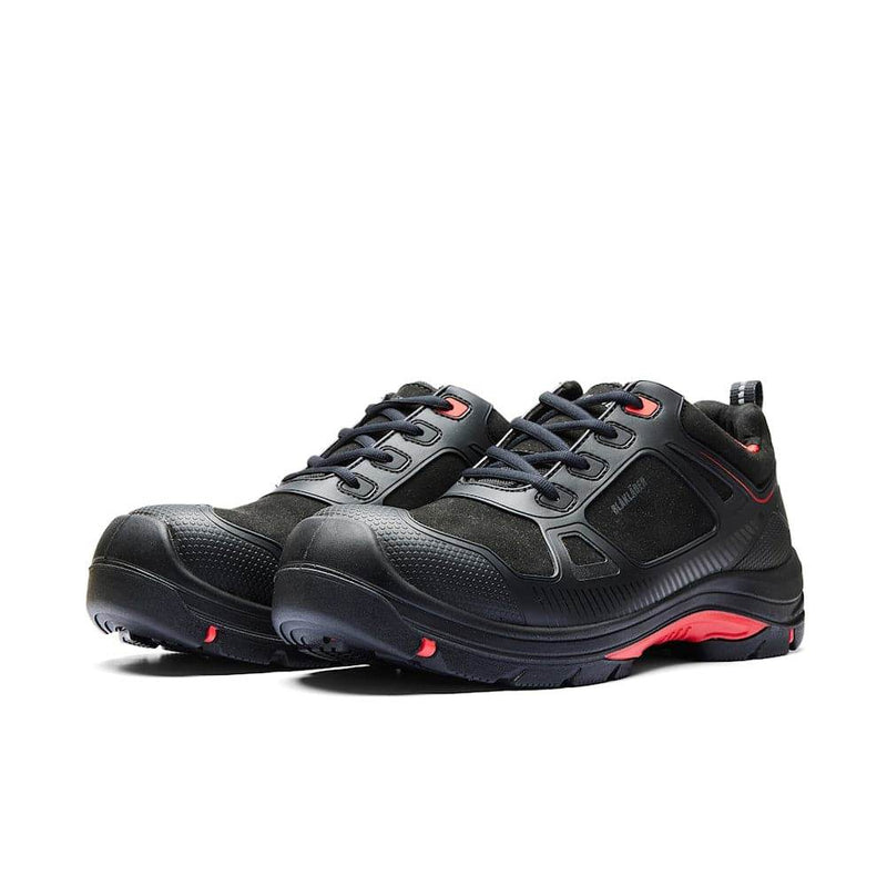 Pair of black safety shoes with red accents on a white background
