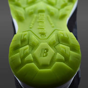 Close-up of a green sole with brand logo on a dark background Trade In Timber EXTRA Safety Shoes Boots Trainers Online 