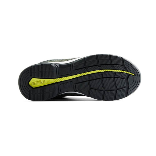 Black and yellow sole of a shoe on a white background