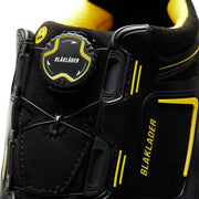 Close-up of a black and yellow Blaklader work boot with branding details.