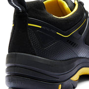 Black and yellow safety shoe with 'Metal Free' label on a white background