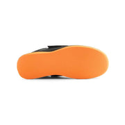 Orange sole of a shoe on a white background