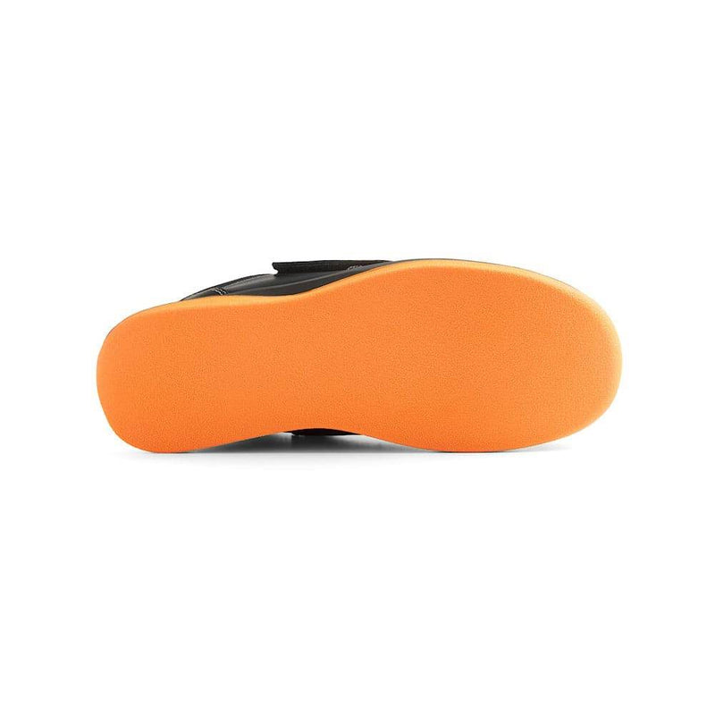 Orange sole of a shoe on a white background