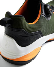 Green and orange safety shoe with brand name on a white background