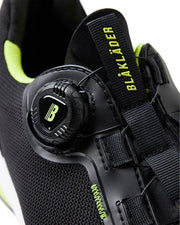 Black and green Blaklader boot with visible branding on a white background