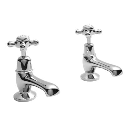 Pair of chrome bathroom faucets on a white background