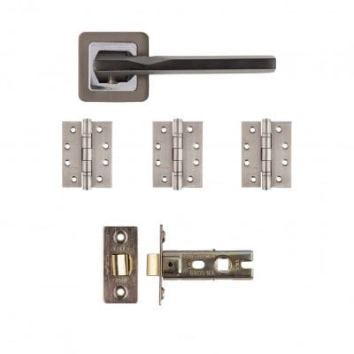Set of door hardware components including a handle and hinges on a white background