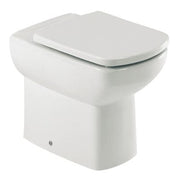 White toilet bowl with a closed lid on a white background