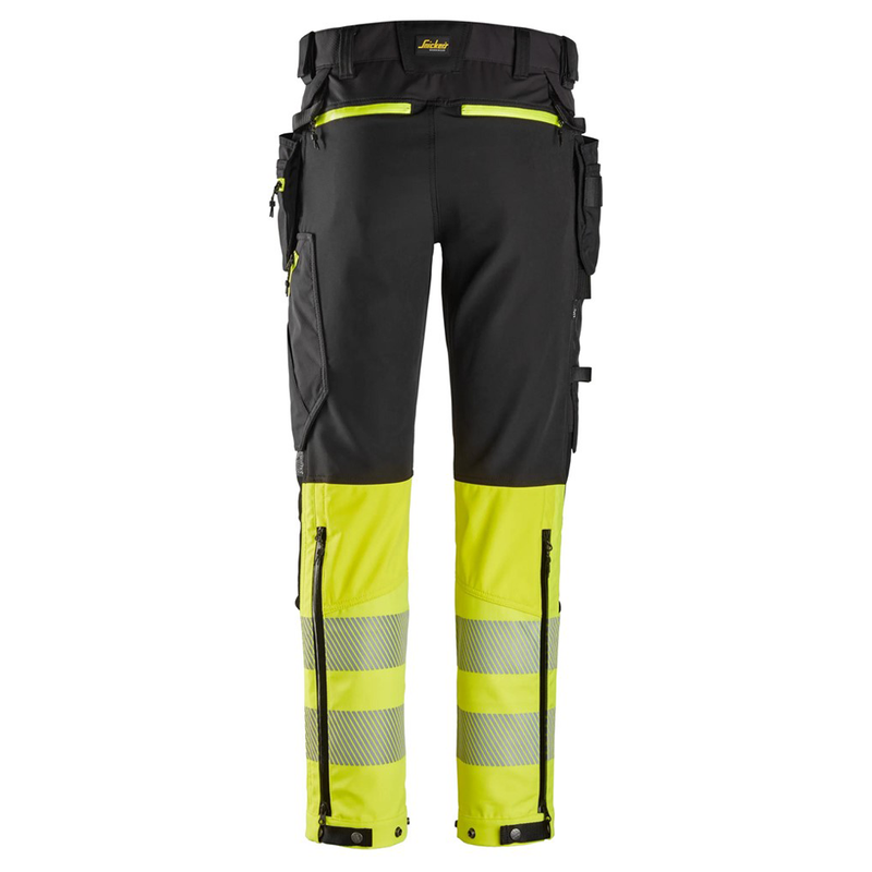 Black and yellow work pants with reflective elements on a white background