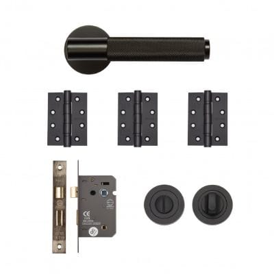 Set of black door hardware components on a white background