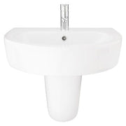White ceramic sink with a chrome faucet on a white background