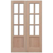 Pair of wooden double doors with glass panels on a white background
