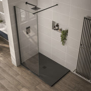 Modern bathroom with a glass shower enclosure and black shower tray.
