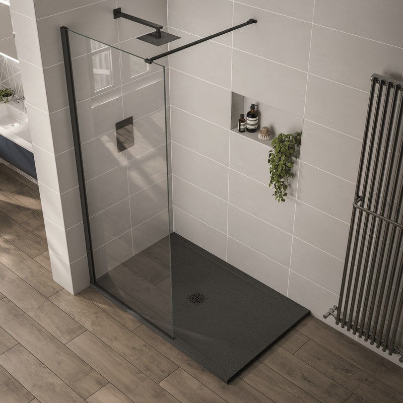Modern bathroom with a glass shower enclosure and black shower tray.