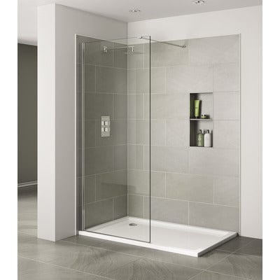 Modern shower enclosure with glass door in a tiled bathroom