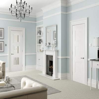 Living room with light blue walls, white fireplace, and modern decor.